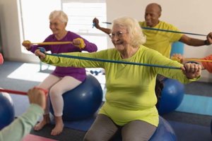 seniors enjoy senior living amenities like exercise classes