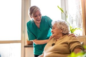 morada cyfair assisted living nurse putting hands on senior woman's shoulders