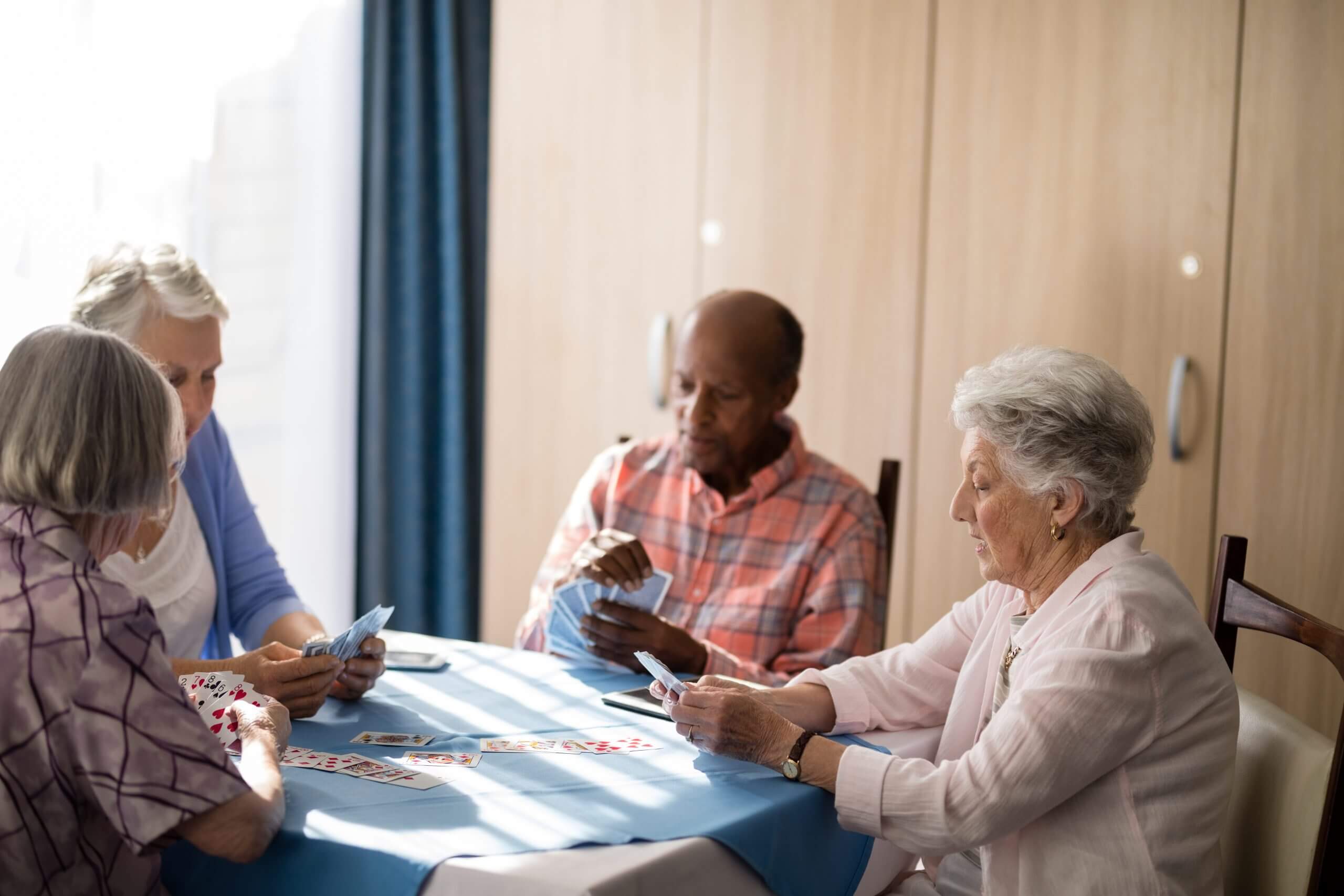 Senior people playing cards